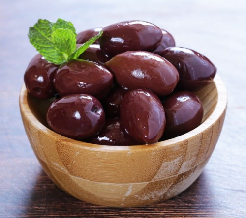 Canva - Red Kalamata Olives on a Wooden Table (1) (1).jpg